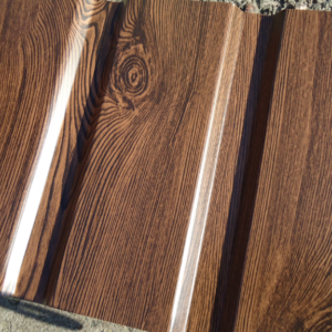 Фасад із профнастилу з 10 під дерево горіх 1170 мм ширина аркуша